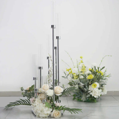 Elegant flower vase arrangement with multiple glass tubes and fresh blooms.