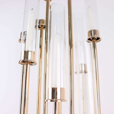 Modern chandelier with glass and metal accents, elegant design.