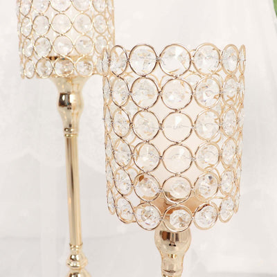 Elegant crystal candle holders with a gold finish.
