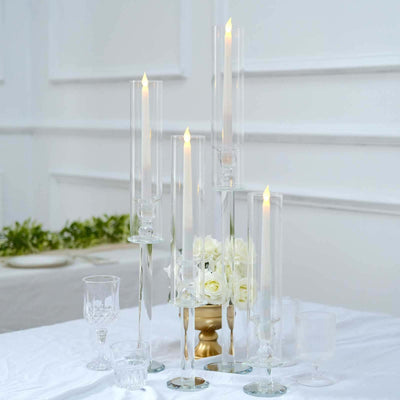 Elegant glass candle holders with LED candles in a stylish arrangement.