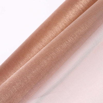 Rose gold sheer fabric roll with a shiny finish.