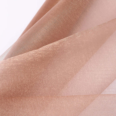 Sheer bronze fabric draped elegantly, showcasing its texture and shimmer.