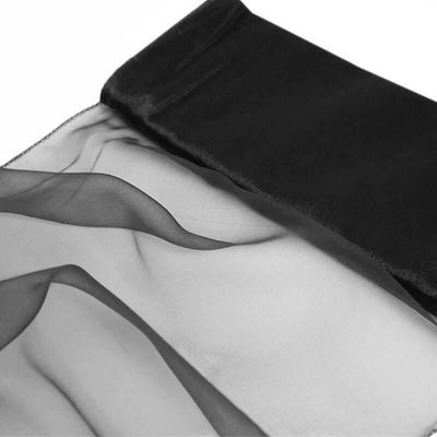 Black sheer fabric with satin trim, ideal for elegant designs.