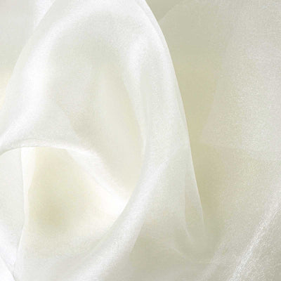 Sheer white fabric close-up showing smooth texture and soft drape.