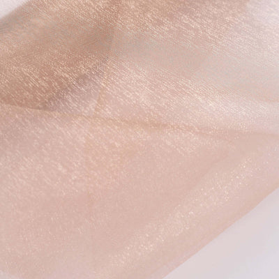 Sheer blush fabric with a subtle shimmer texture
