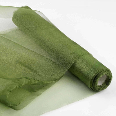 Green sheer fabric roll on a white background