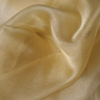 Golden sheer fabric draping elegantly, showcasing its smooth texture and sheen.