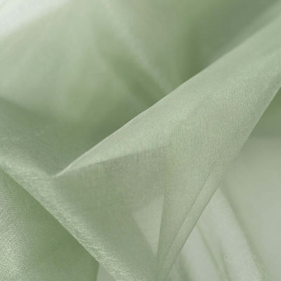 Light green sheer fabric draped elegantly, showcasing soft texture and sheen.