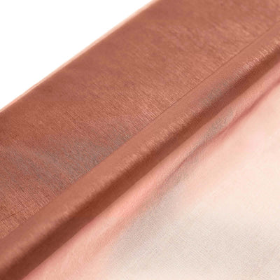 Copper satin fabric roll on a white background.