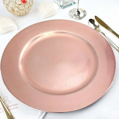 Rose gold charger plate on a dining table setting.