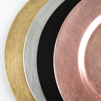 Set of decorative plates in gold, silver, black, and rose gold finishes.