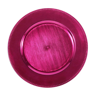 Fuchsia decorative plate with beaded edge on a white background