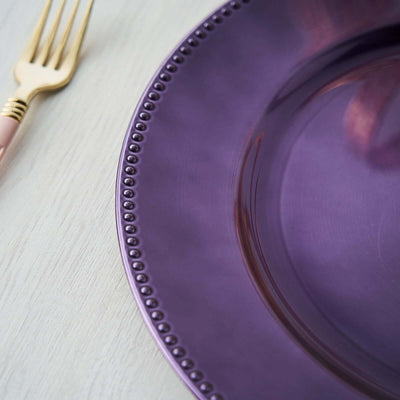 Purple decorative plate with a beaded edge and a gold fork.