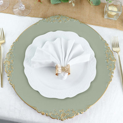 Elegant table setting with ornate plate and napkin holder.