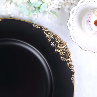 Elegant black plate with ornate gold detailing.