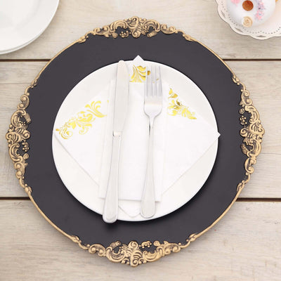 Elegant place setting with decorative plate, cutlery, and napkin.
