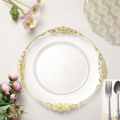 Elegant white plate with gold decorative rim, surrounded by flowers and utensils.