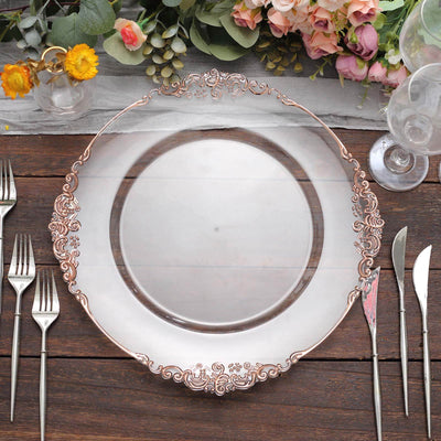 Elegant rose gold rimmed glass plate on a rustic wooden table setting.