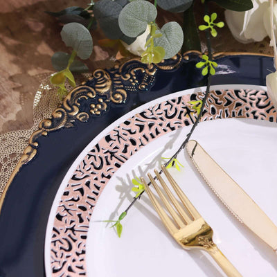 Elegant navy and pink decorative plate with gold fork and floral accents.