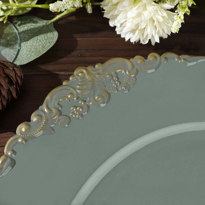 Decorative teal plate with ornate gold trim on a wooden surface.