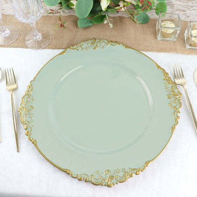 Elegant mint green plate with gold ornate edge on a dining table setting.