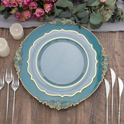 Elegant teal plate with gold trim on a rustic wooden table setting.