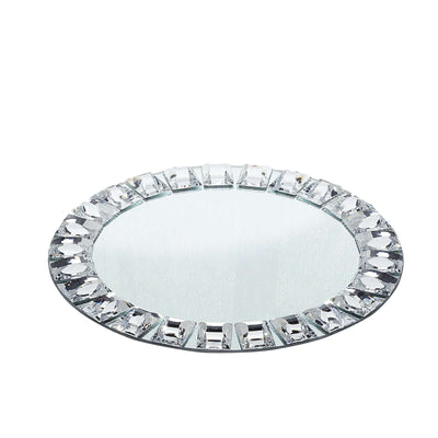 Round mirror with crystal embellishments on edge, reflecting light beautifully.
