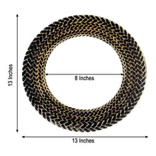 A black and gold glass charger plate in a basketweave shape with measurements of 13 inches and 8 inches