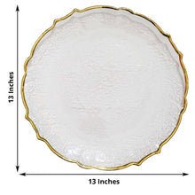 A glass charger plate with a clear gold color and a scalloped edge rim