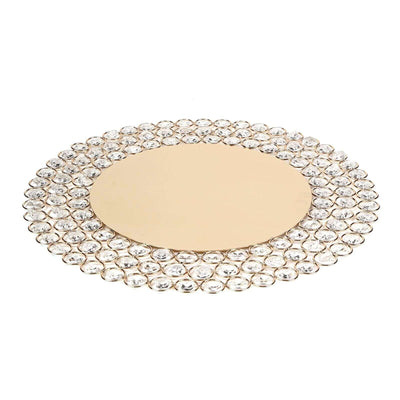 Round decorative mirror with crystal embellishments on a gold base.