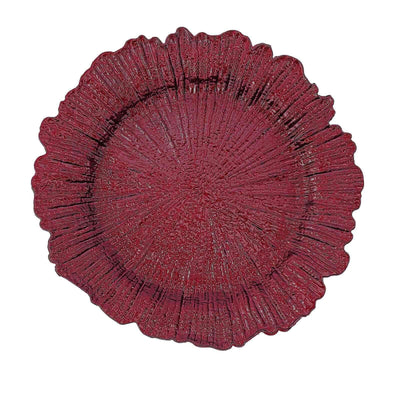 Red decorative plate with a textured floral design