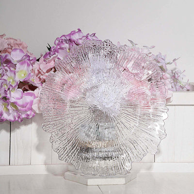 Textured clear glass dish with floral backdrop.