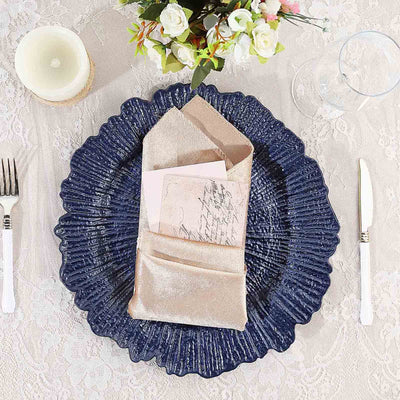 Elegant navy plate with textured rim, gold napkin, and vintage card setting.