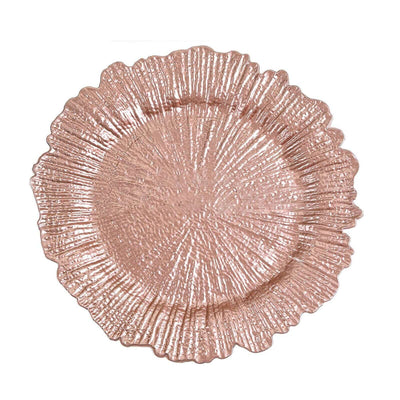 Rose gold decorative plate with textured floral design.