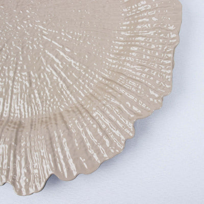 Textured beige decorative plate with scalloped edges.