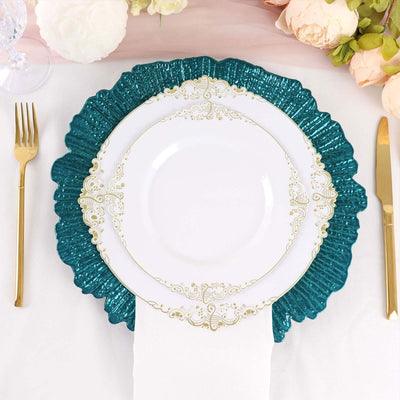 Teal decorative plate with white plate and gold accents on a table setting.