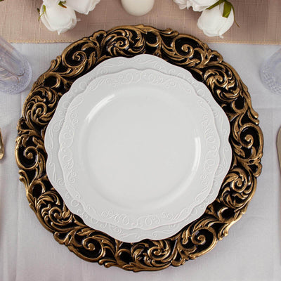 Elegant white plate on ornate gold charger, set for a sophisticated dining experience.