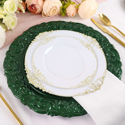 Elegant green and white dinner plate set with gold accents on a stylish table setting.
