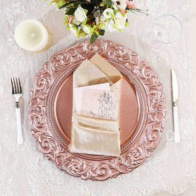 Elegant rose gold charger plate with napkin and card, set on a lace tablecloth.
