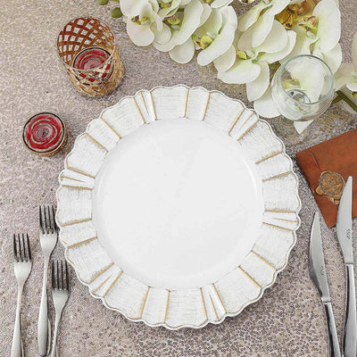 White decorative plate with gold accents on a textured table setting.