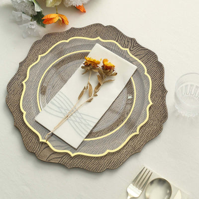 Decorative plate with napkin and dried flowers on a textured table setting.