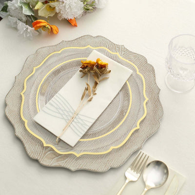 Decorative plate setting with floral accents and napkin arrangement.