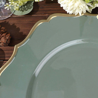 Green decorative plate with a gold rim on a wooden table.