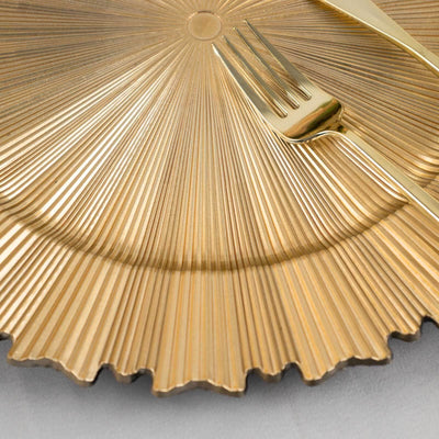 Gold decorative plate with fork, featuring a textured, fluted design.