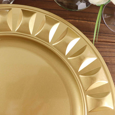 Gold decorative charger plate with textured rim on a wooden table.