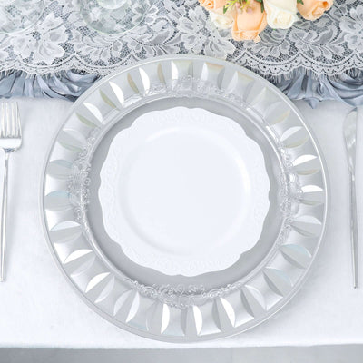 Elegant clear charger plate with decorative rim on a beautifully set table.