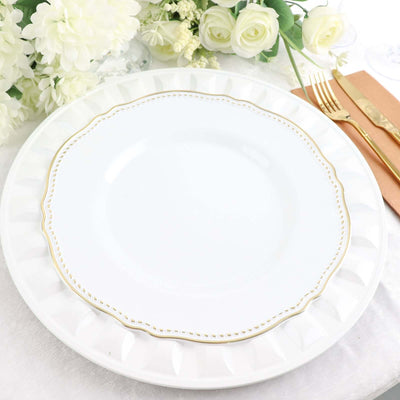 Elegant white dinner plate with gold rim detail.