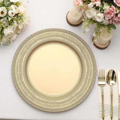 Decorative gold charger plate with intricate design on a table setting.