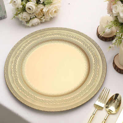 Elegant gold decorative plate on a table with floral arrangement.