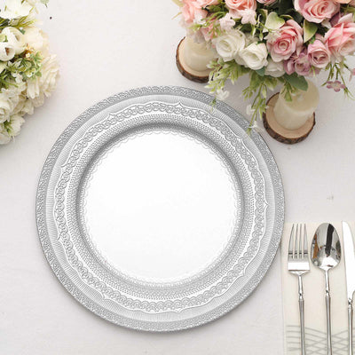 Elegant decorative charger plate with intricate design, styled with floral arrangements.